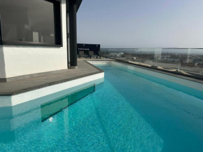 Villa Poseidon Corralejo with Private Heated Pool, Sauna and Stunning Volcano Views by Amazzzing Travel